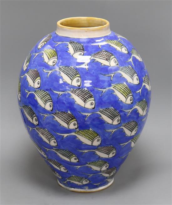 A large Studio pottery vase of ovoid form, decorated all over with fish swimming on a blue ground height 40cm